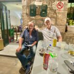 Friends enjoying a relaxed evening with food and drinks in Richea