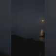 Original frame from the MOURIES Instagram Reel showing moonlight reflected across the sea
