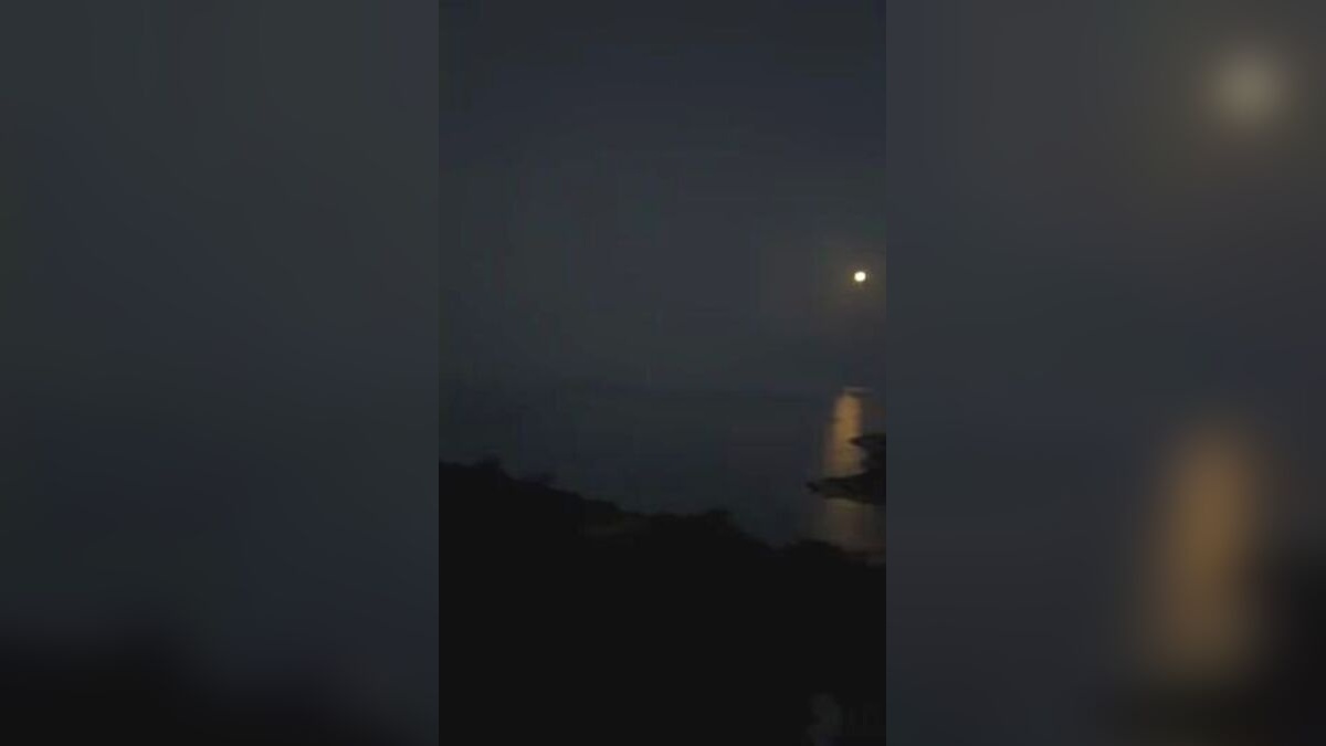 Original frame from the MOURIES Instagram Reel showing moonlight reflected across the sea