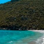 Turquoise water and a quiet beach featured in the Instagram Reel